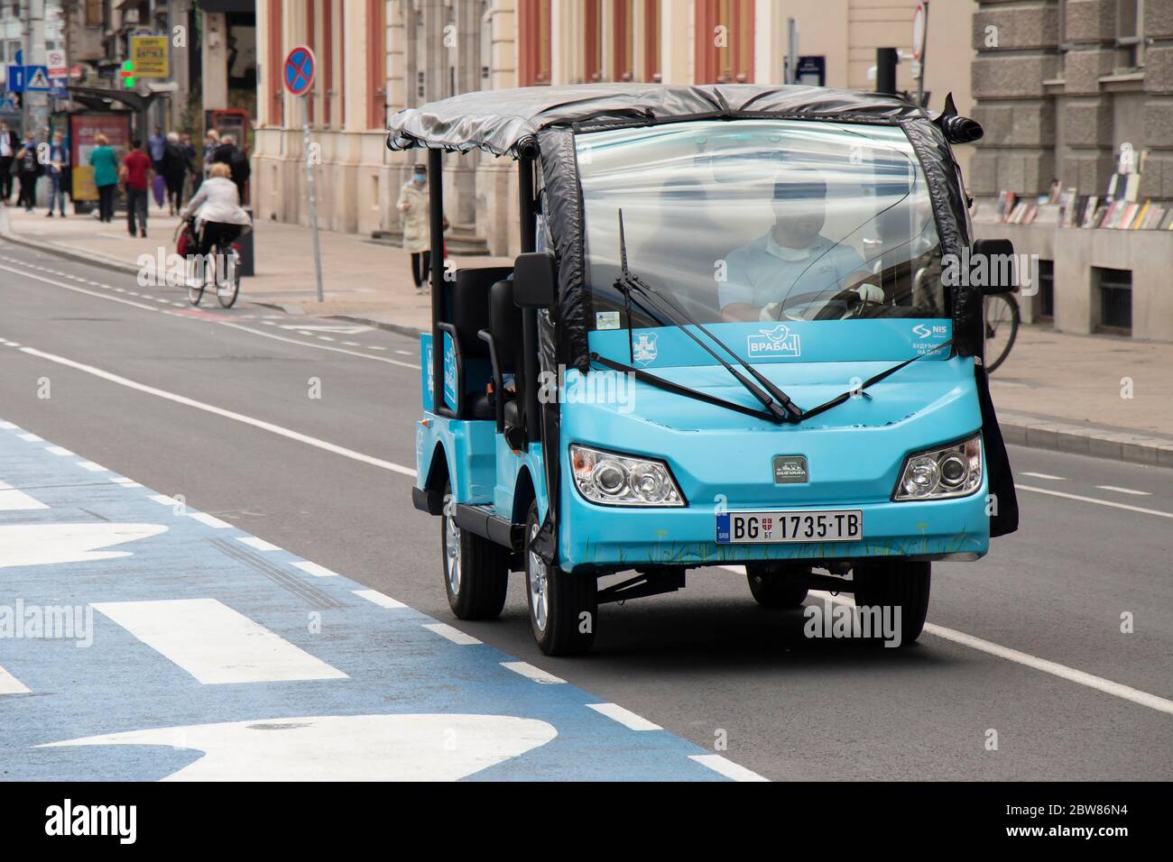 Belgrade, Serbia - May 21, 2020: Open electric vehicle '' Sparrow'' on its route on Belgrade city center streets. It covers a bit more that 2 km Stock Photo