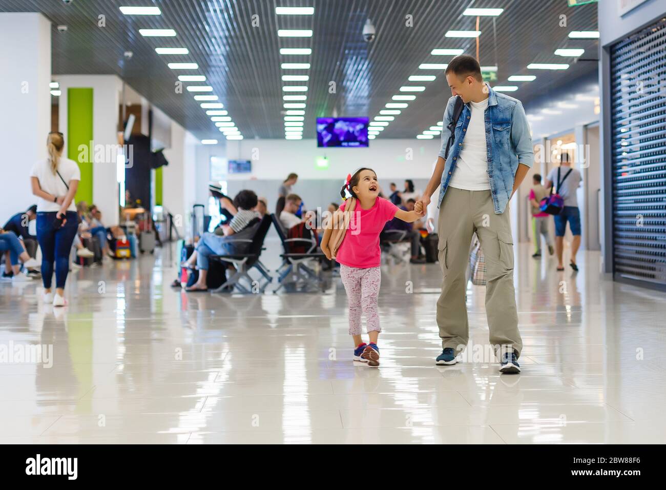 father and little daughter walking in the airport, family travel Stock ...