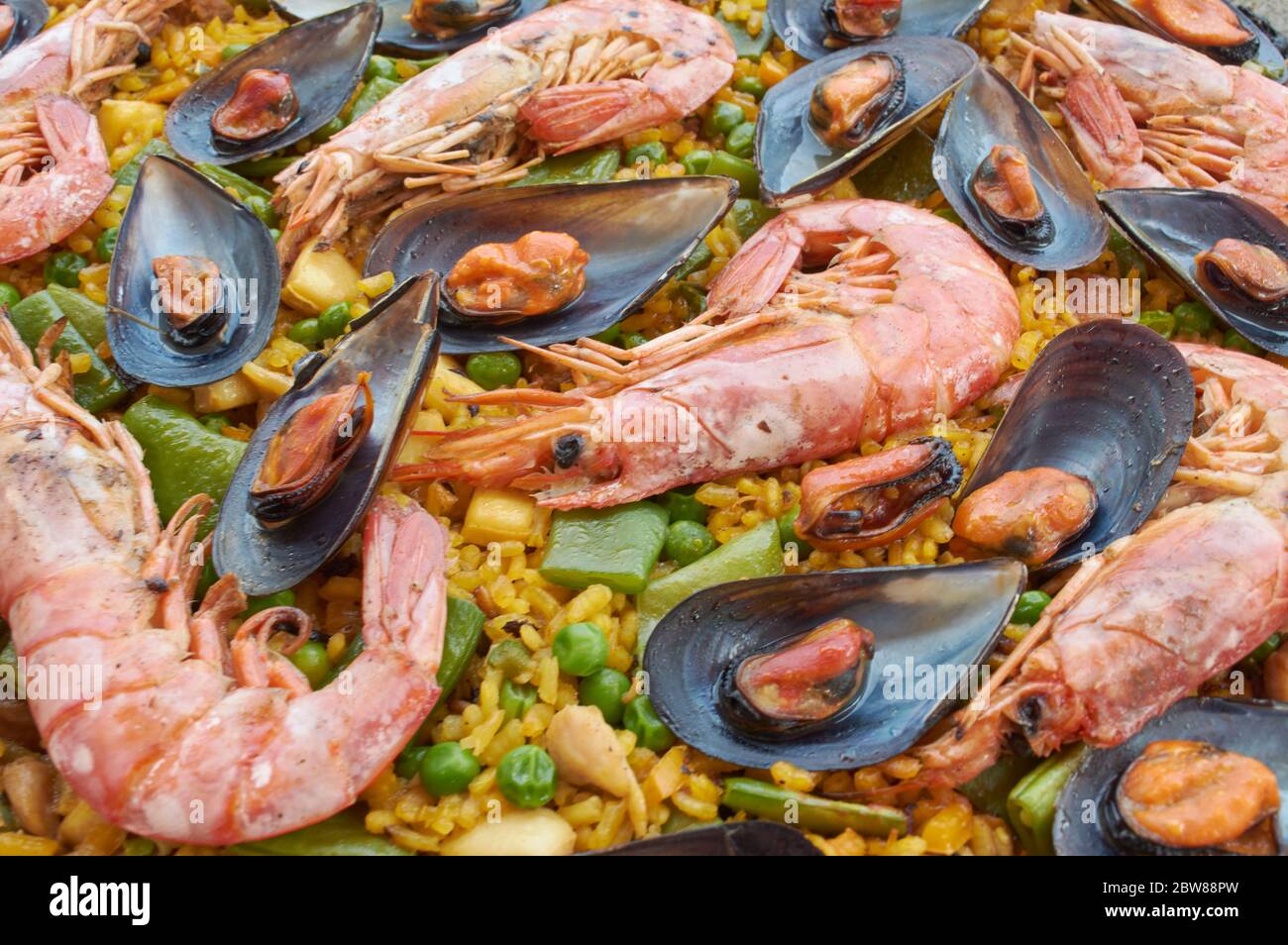 Traditional Spanish Paella with seafood vegetable meat, and rice Stock Photo