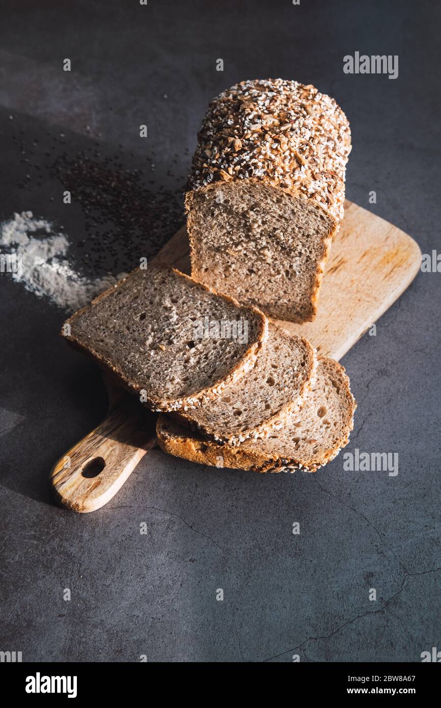 Homemade millet and buckwheat bread slices. Vertical picture Stock