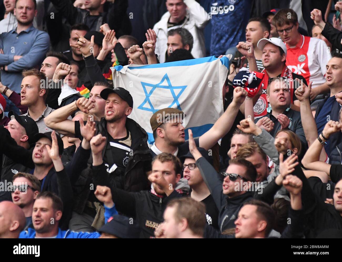 LONDON, ENGLAND - APRIL 30, 2019: Ajax fans with Israel flag pictured in the stands prior to he first leg of the 2018/19 UEFA Champions League Semi-finals game between Tottenham Hotspur (England) and AFC Ajax (Netherlands) at Tottenham Hotspur Stadium. Stock Photo