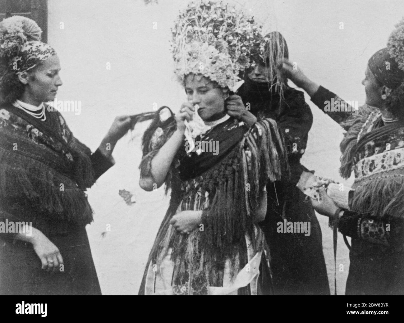 Mesokovesd , Hungary .The wedding headdress is a gorgeous affair of gilt and tinsel . 1925 Stock Photo