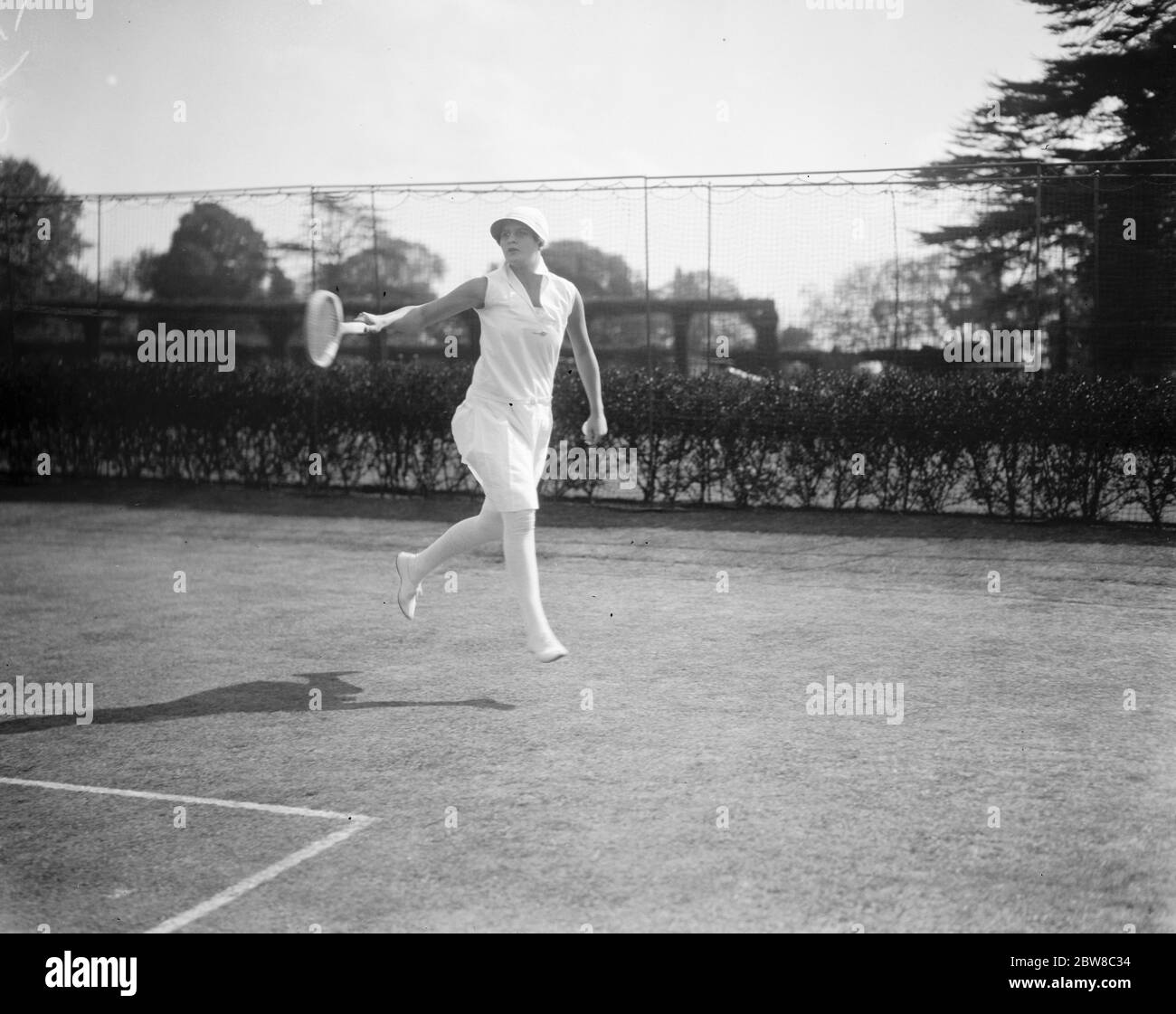 South African women tennis players practice at Hurlingham . Miss Heine in play . 3 May 1927 Stock Photo