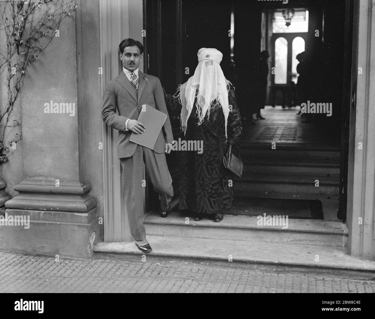Begum of Bhopal leaves for India after Abdicating in favour of her son . The Begum of Bhopal with the new ruler at the door of Belmont House , Parkside , Wimbledon , just before their departure . 19 May 1926 Stock Photo