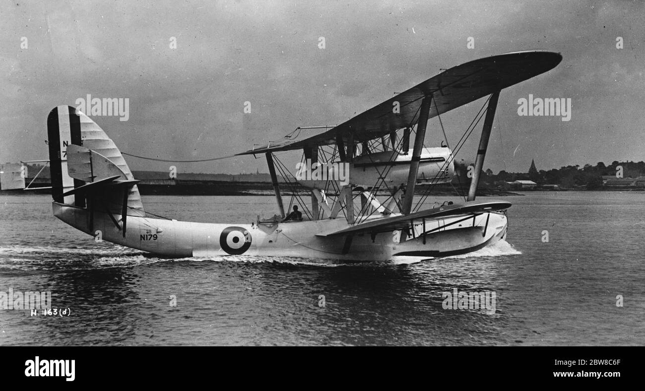 All metal air liners to link the Empire : huge British machine makes a successful Baltic cruise . The  Singapore  taxi ing along the water . 13 September 1927 Stock Photo