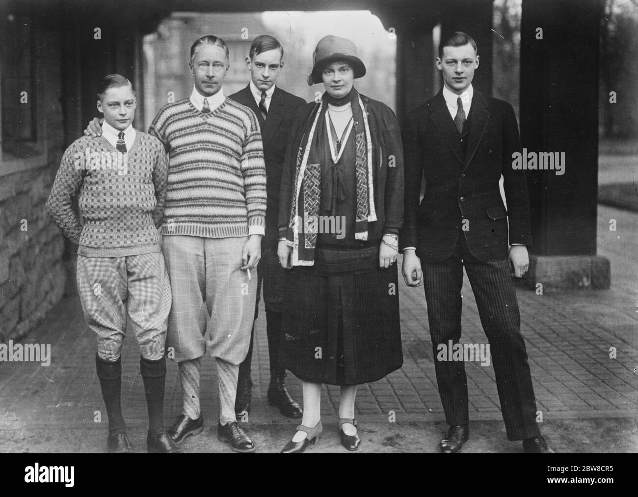 Ypungest sons of the ex Crown Prince of Germany confirmed . The latest photograph of the ex Crown Prince and Princess with their sons . Behind the ex Crown Prince is Prince Hubertus and on his left Prince Friederich . 27 May 1927 Stock Photo