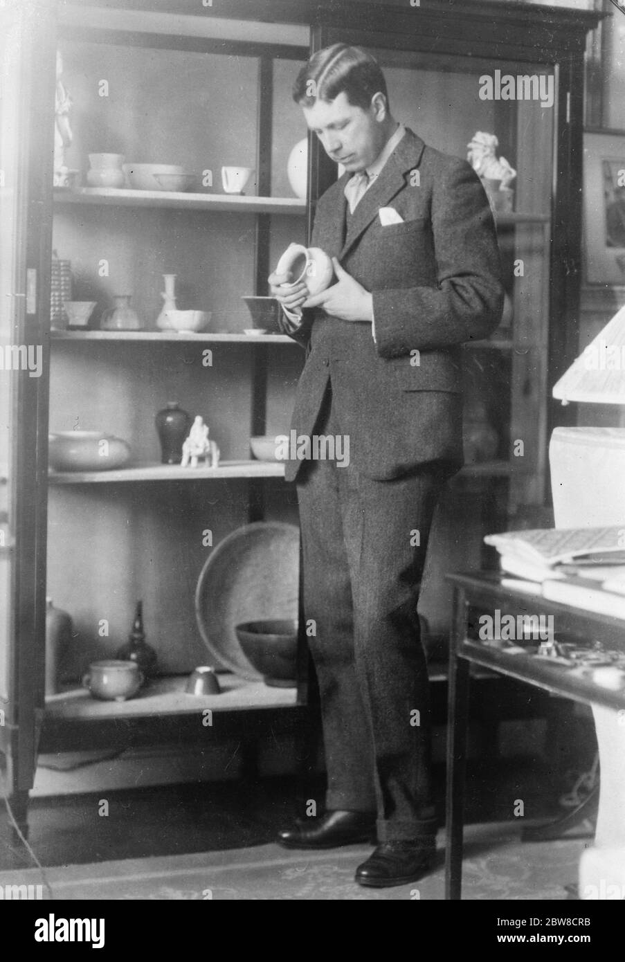 Future King condemned by his  Tailor & Cutter  . In Sweden there is a paper which corresponds to our  Tailor & Cutter  . It complained bitterly of the clothes worn by the Sweden Crown Prince during his trip to America . The Crown Prince of Sweden examining his collection of Chinese porcelain . 6 May 1927 Stock Photo