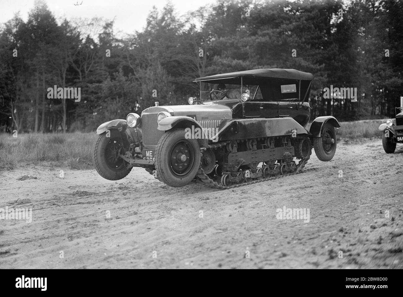 Colonial office conference visitors see war office demonstration of transport cross country vehicles at Aldershot . Reconnaissance car . Experimental staff car , combined wheel and track . 21 May 1927 Stock Photo
