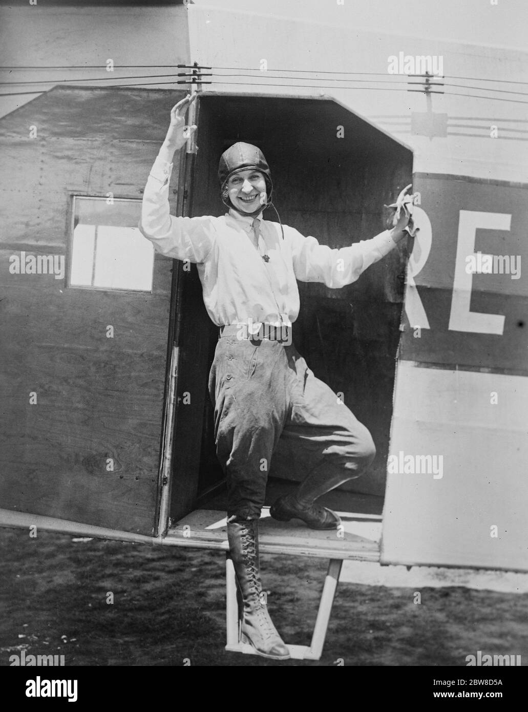 Luba Phillipps entering the Tri engined Fokker Plane . A duplicate of the America , except a ten foot less wing spread , in which she may attempt a transatlantic flight to London . July 1927 Stock Photo