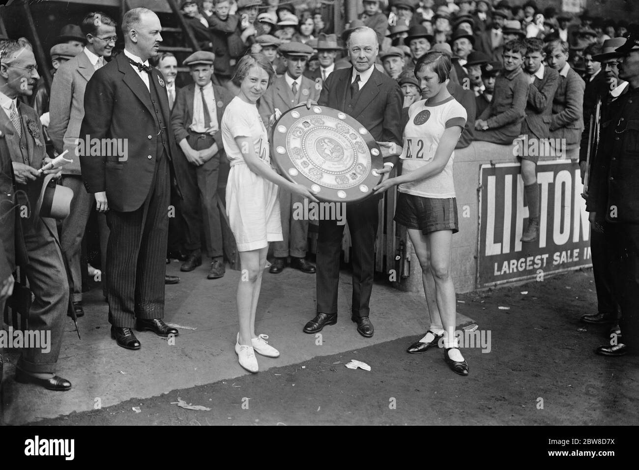 Junior inter-county athletic championships at Stamford Bridge . Sir W Joynson Hicks presenting the Shield to the representatives of London and Essex who tied for the championship . 16 July 1927 Stock Photo