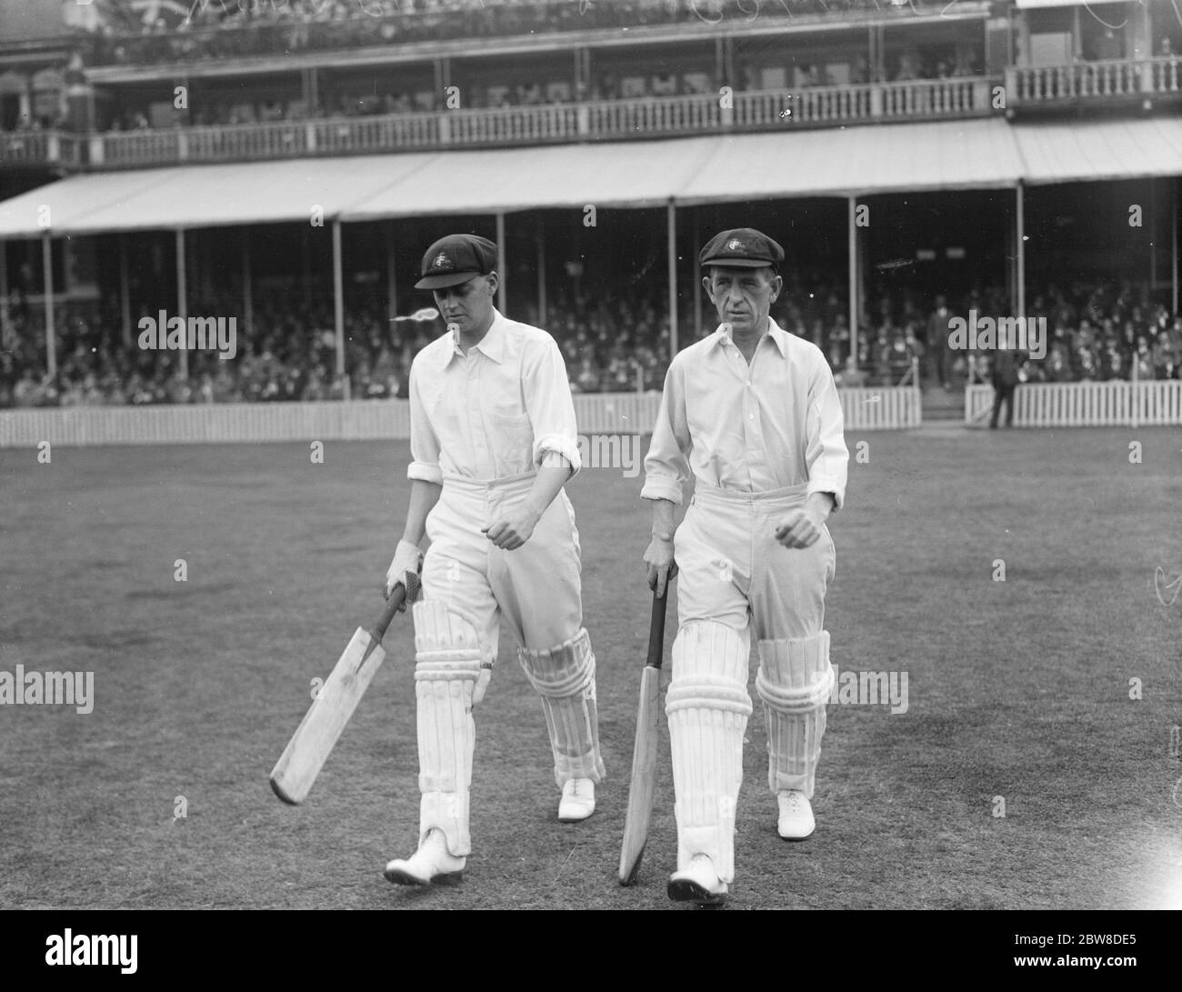Second day of final test match at the Oval . Herbie Collins and Bill Woodfull going out to resume Australia 's innings . 16 August 1926 Stock Photo