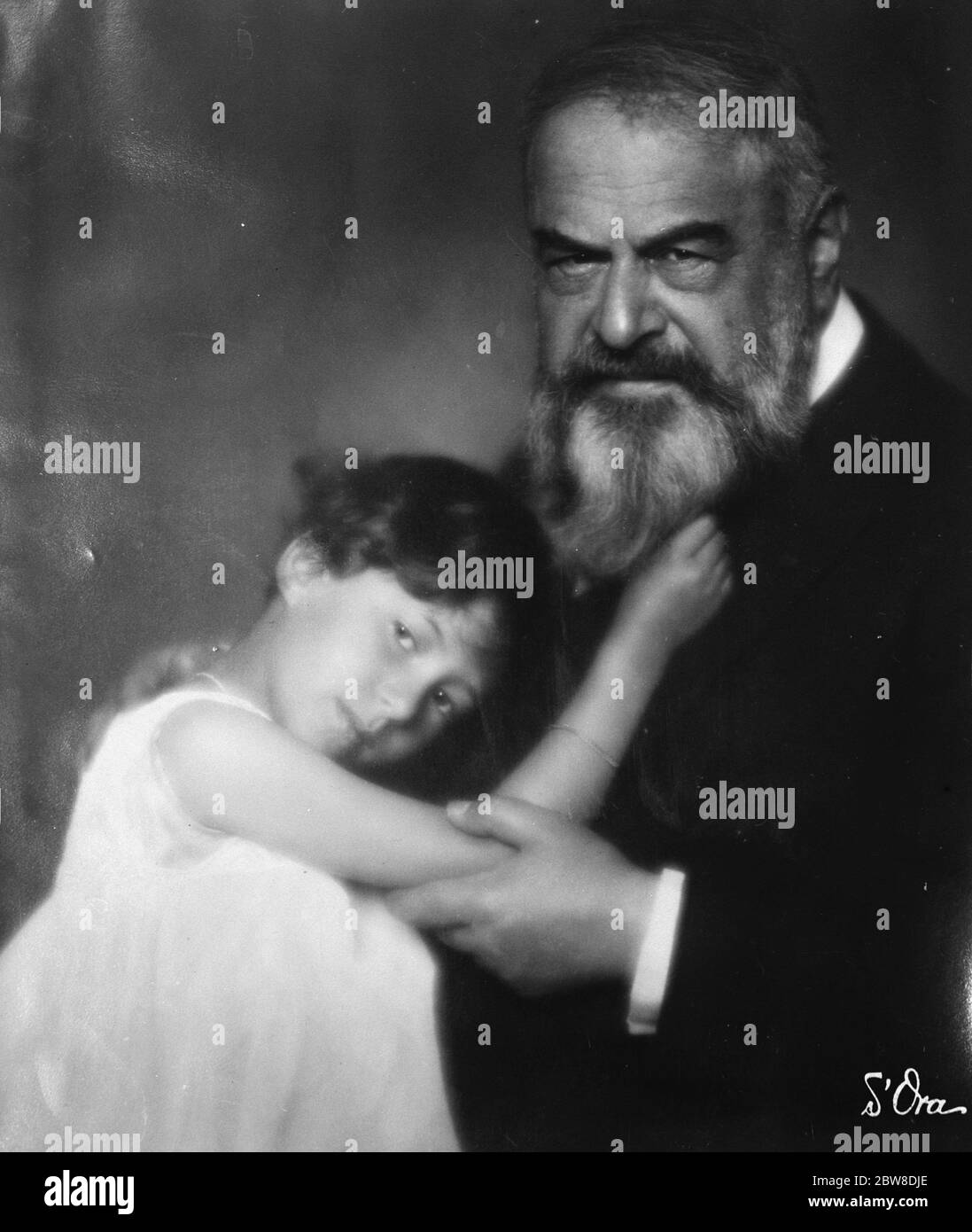 Guest of honour at the Anglo - French Luncheon Club . Mr Tristan Bernard , the famous French novelist and his granddaughter . 29 May 1928 Stock Photo