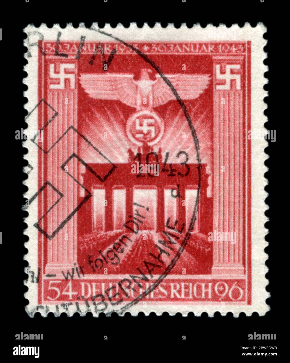 German historical stamp: 10th anniversary of Adolf Hitler's takeover of power. Imperial eagle on the background of the Brandenburg gate. Germany Stock Photo
