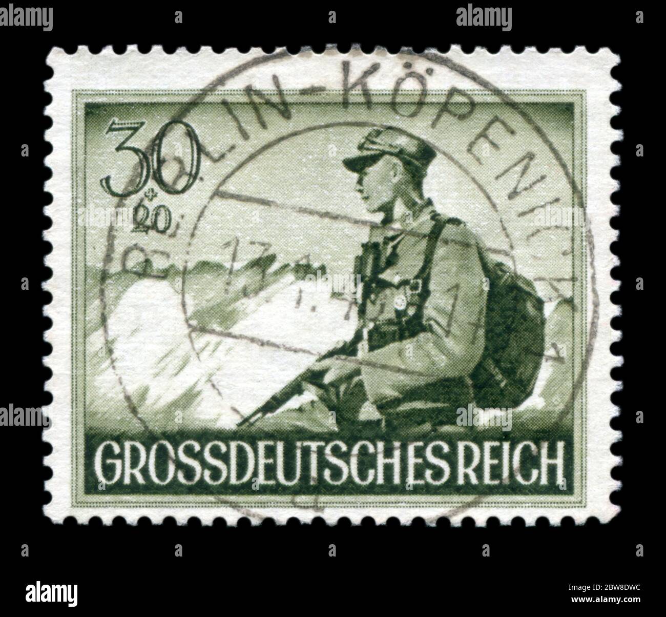 German historical stamp: A soldier from the mountain infantry squad Edelweiss. Day of commemoration of the fallen soldiers, issue 1944, Germany Stock Photo