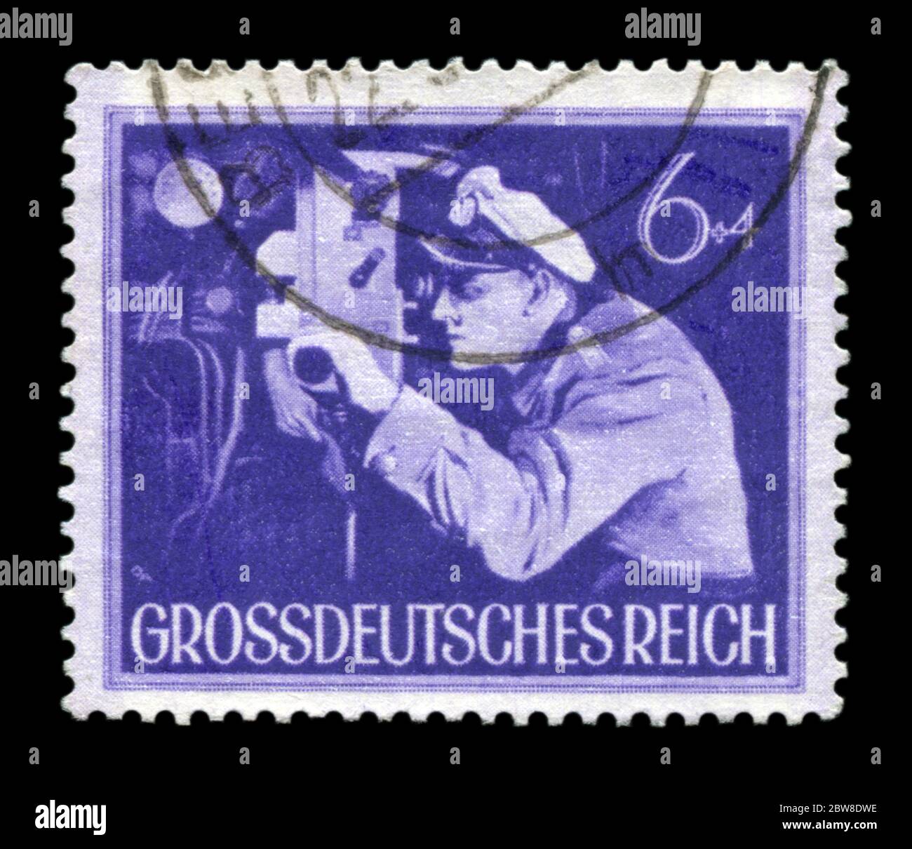German historical stamp: The commander of the submarine at the periscope. The Army Of The third Reich. Day of commemoration of the fallen soldiers, 44 Stock Photo