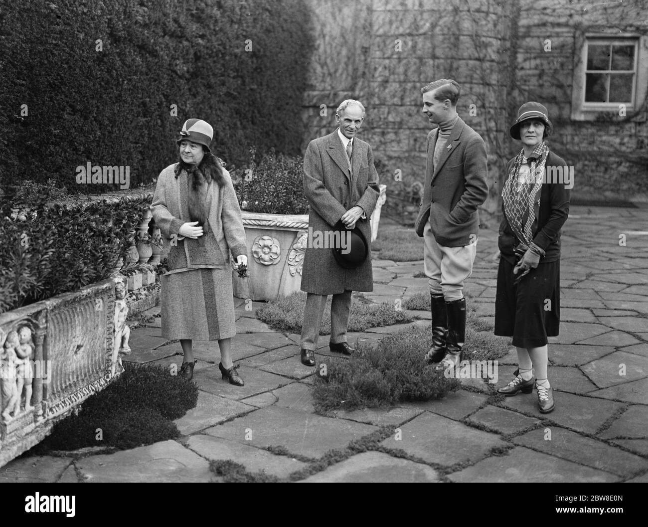 Mr and Mrs Henry Ford with Lady Astor and the Honourable H W Astor on the terrace at Cliveden , Buckinghamshire . 14 April 1928 Stock Photo