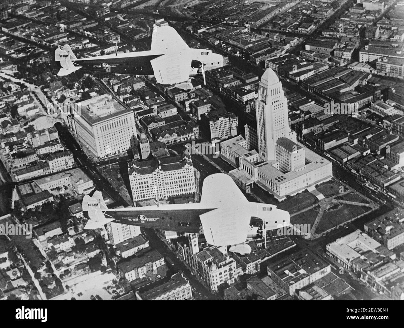 Aerial view of famous city . An interesting and unusual air view of the Los Angeles , California showing two Fokker monoplane ' s in flight . 23 January 1931 Stock Photo