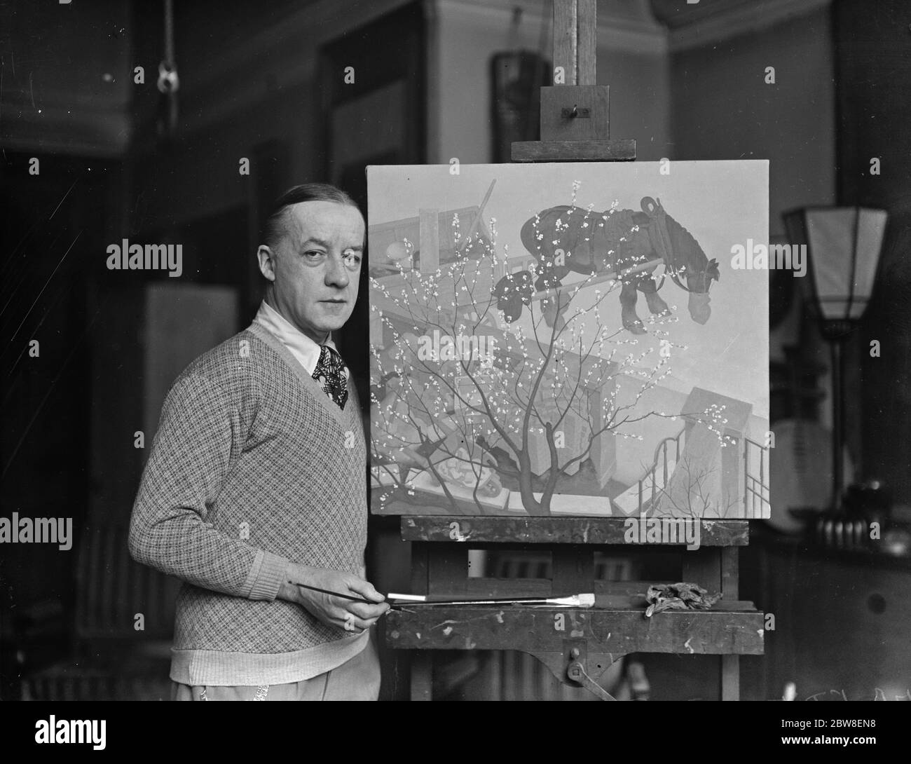 Mr Edmund Dulac with the painting he is to exhibit for the first time at the Royal Academy . 21 March 1932 Stock Photo