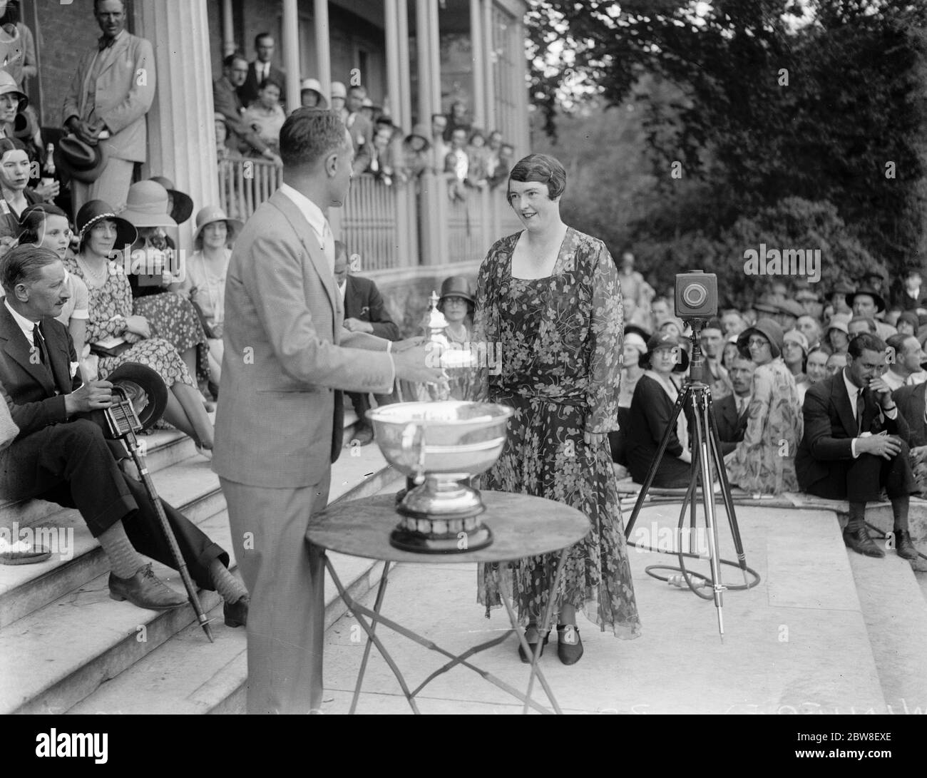 Woman wins the King 's Cup Air Race . Miss Winifred Brown being presented with the cup by Sir Philip Sassoon . 5 July 1930 Stock Photo
