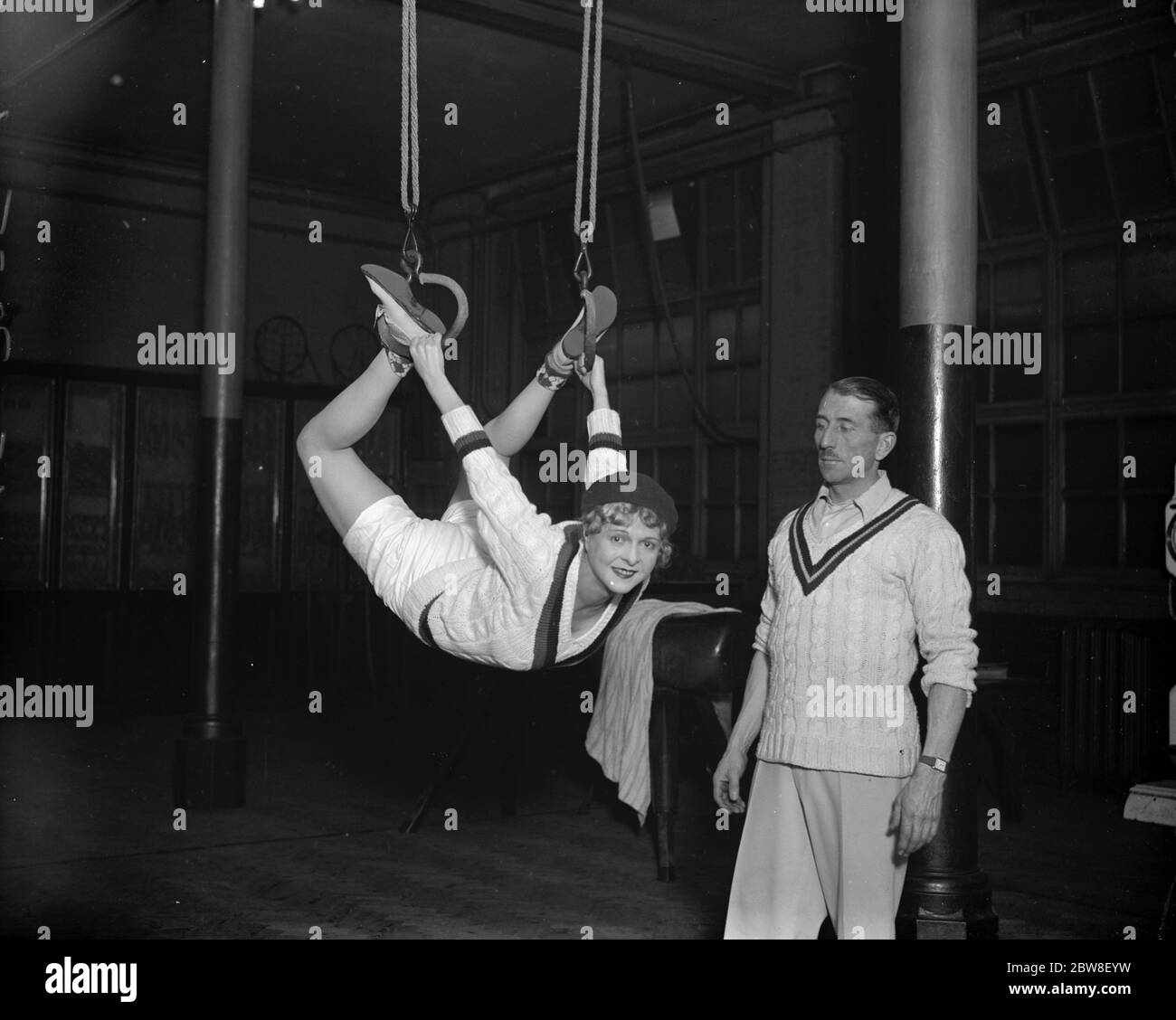 England ' s popular young film star at the Mayfair Gymnasium . Miss Flora le Breton on the trapeze . 31 January 1930 Stock Photo