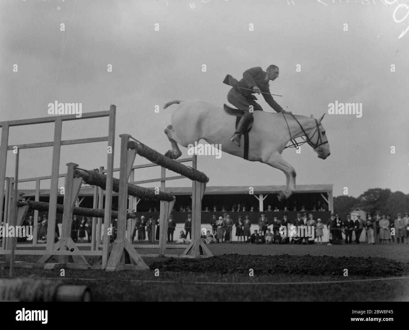 Royal Horse Show at Richmond . Mr F V Grange 's  Desire  competing in the Jumping Class , jumping in fine style . 9 June 1932 Stock Photo