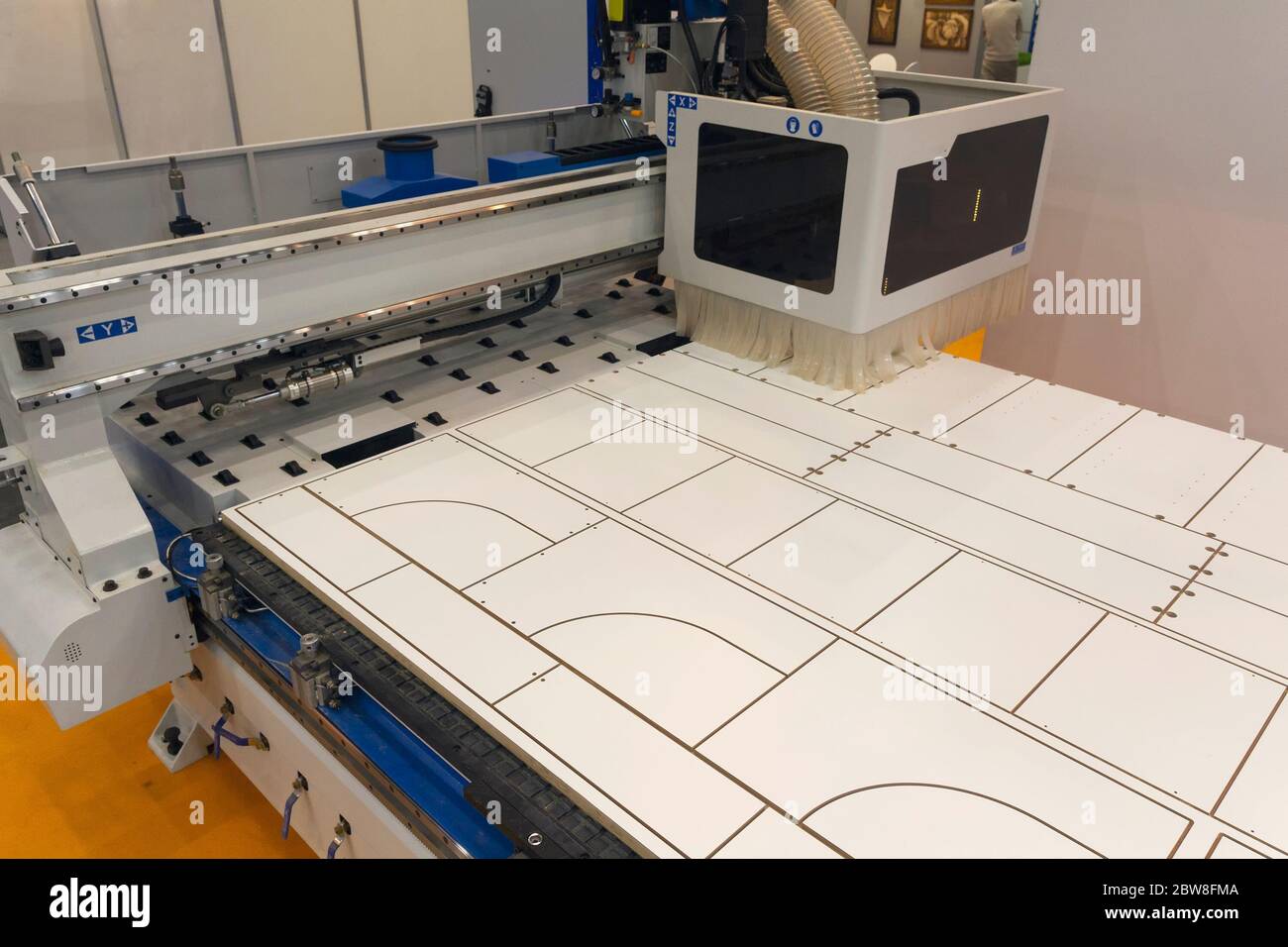 Machine tools format cutting are cut chipboard furniture in the shop. Industry Stock Photo