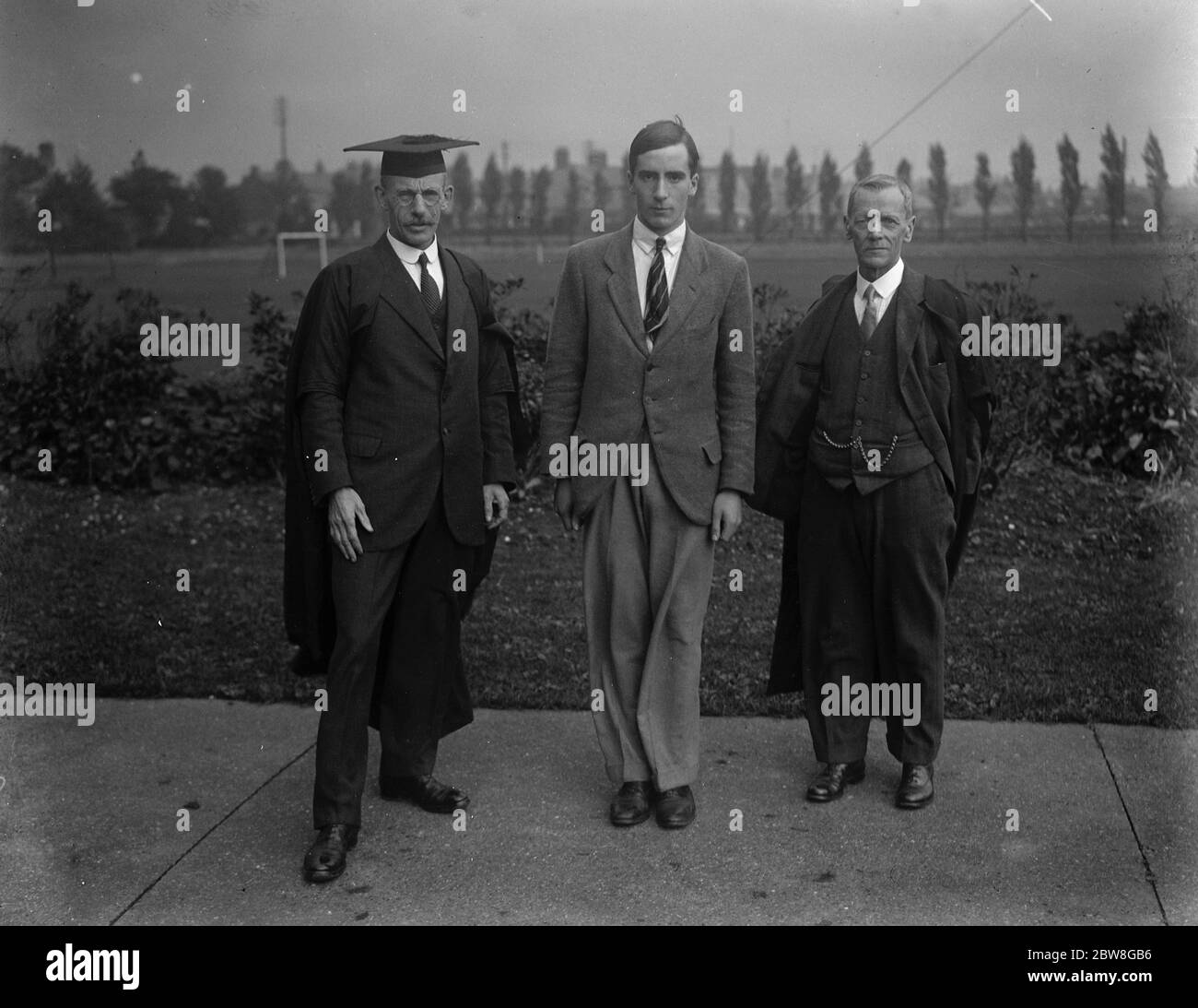 Winner of the King 's gold medal . Mr Anderson ( centre ) with Mr C J L Wagstaff the headmaster , ( on the left ) and Mr Thomson , Mr Anderson's tutor . 6 October 1930 Stock Photo