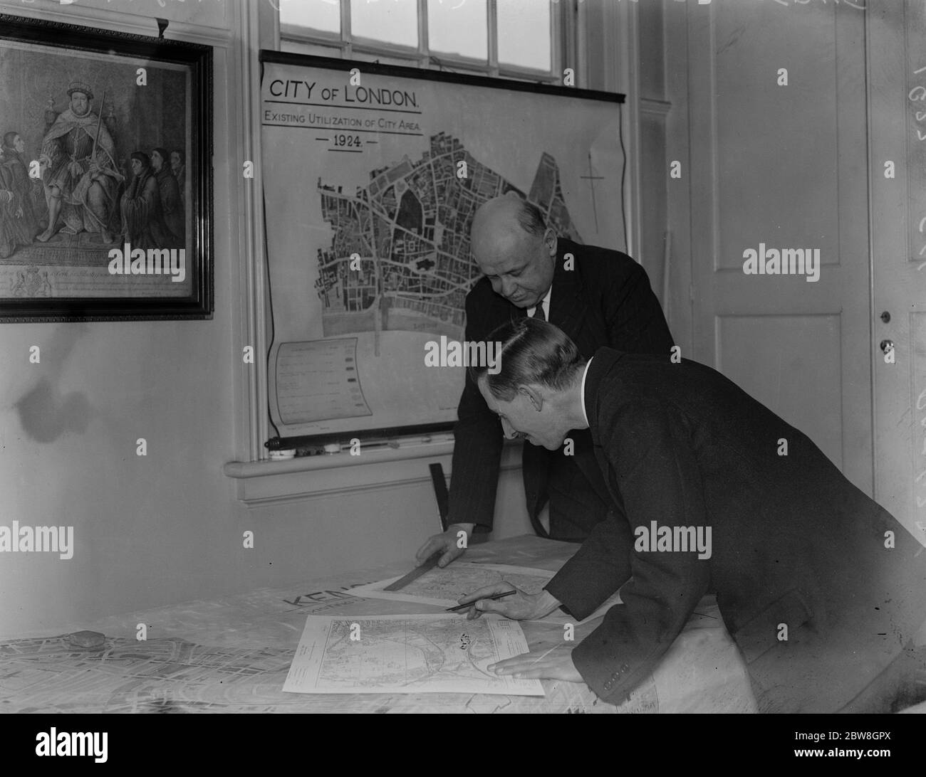 A big town planning for the new London . Mr Percy Lovell ( at back ) with one of his assistants at work on the scheme . 8 February 1932 Stock Photo