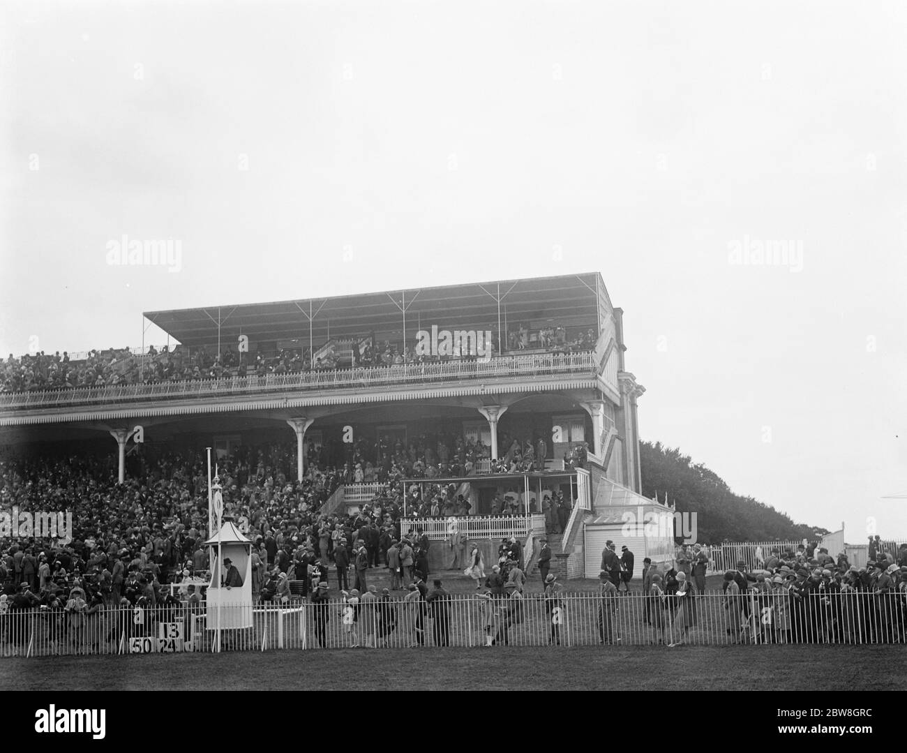 Picture of Goodwood specially taken for Mr Hubbard . The crowded spectator stands . August 1929 Stock Photo