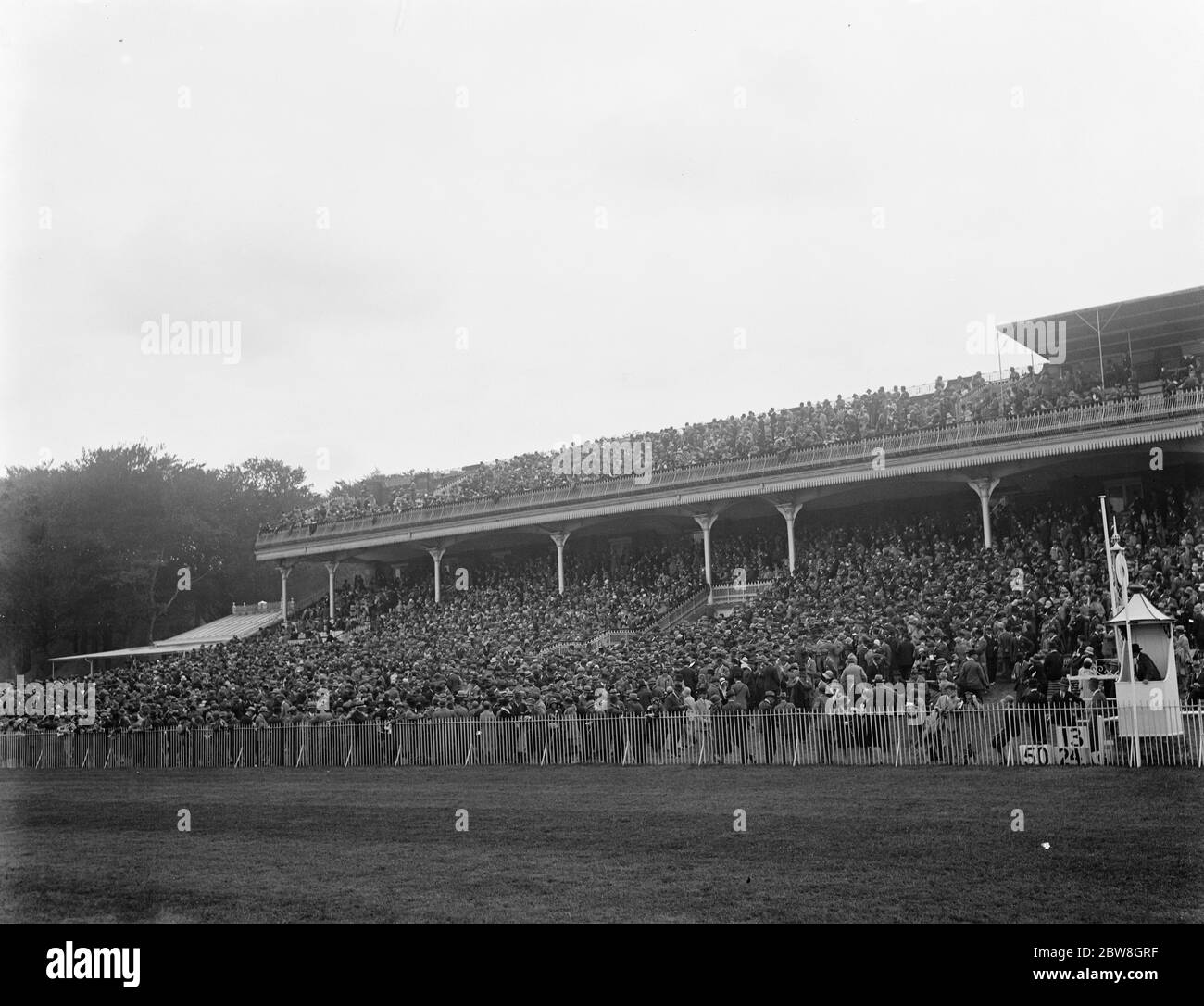 Picture of Goodwood specially taken for Mr Hubbard . The crowded spectator stands . August 1929 Stock Photo