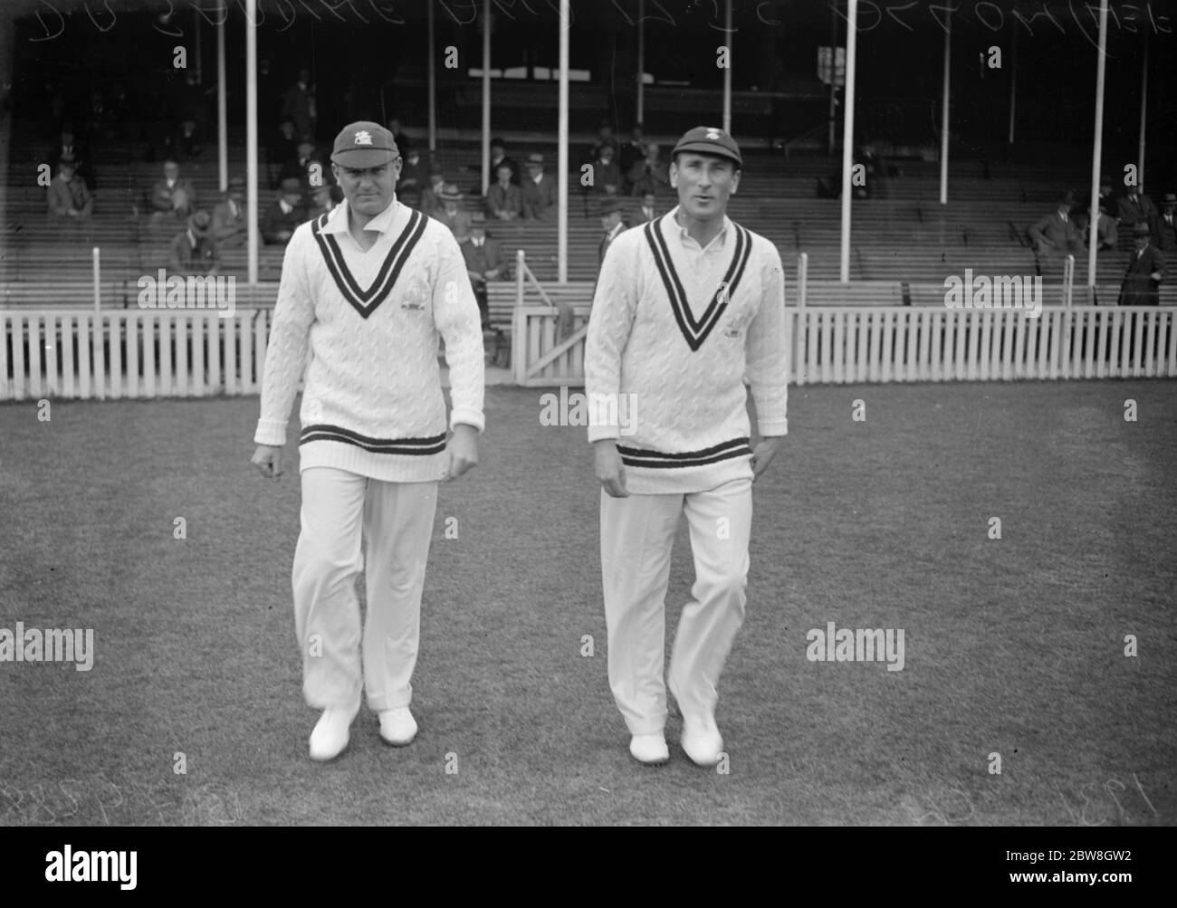 England 's new cricket Captain takes the field . D R Jardine , and M J C Allom ( left ) taking the field for the Gentlemen against the players in the match at the Oval . 11 June 1931 Stock Photo