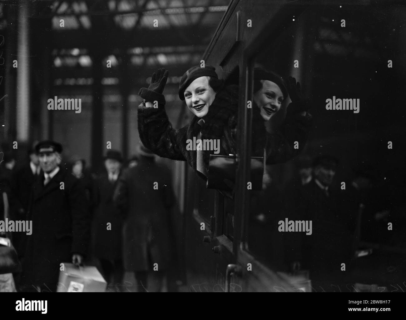 Christmas boat to New York . Renee Gadd , favorite stage and film star saying goodbye as the train left Waterloo . 14 December 1933 Stock Photo
