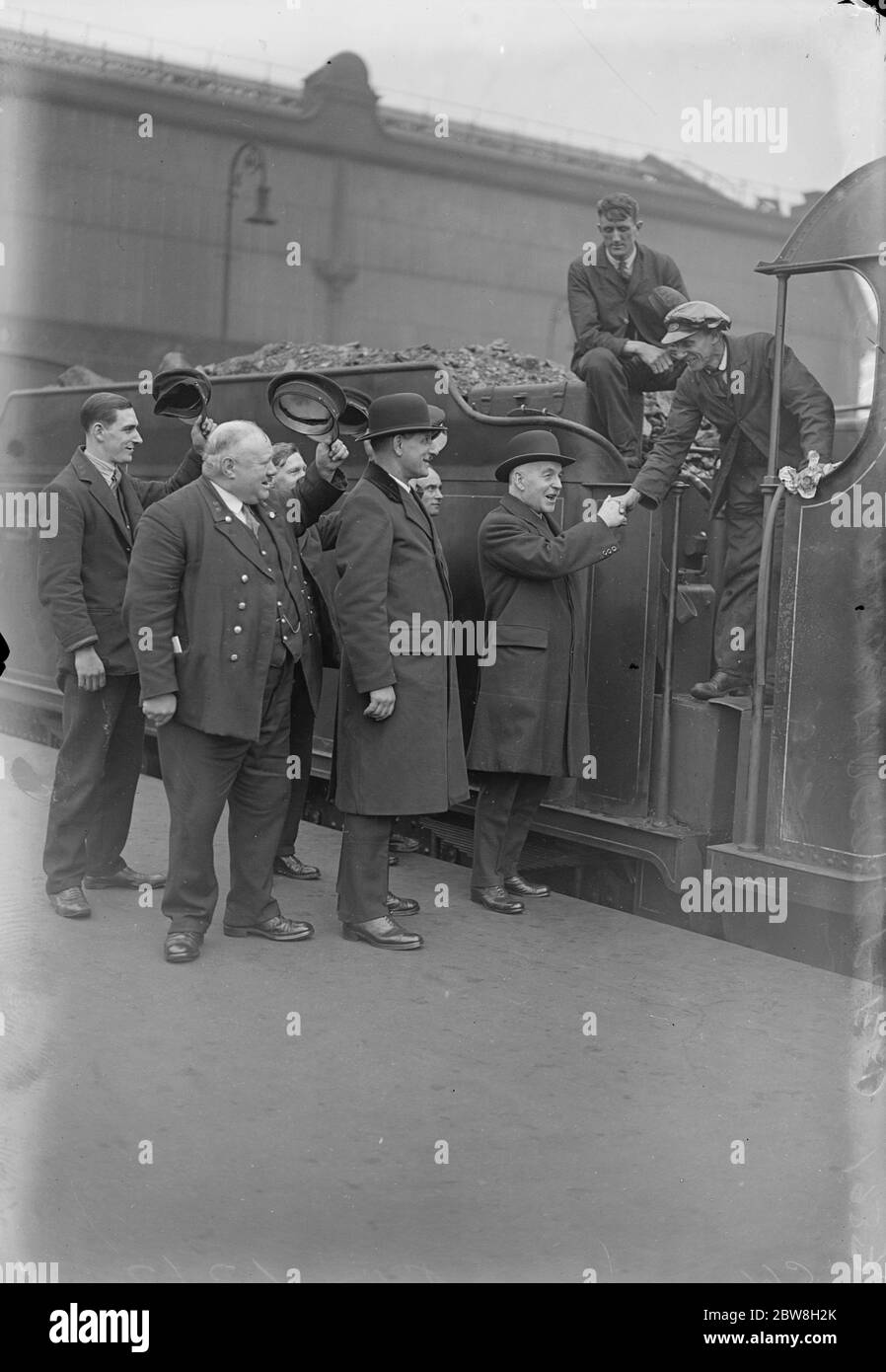 New station master at Waterloo was a passenger in 1892 . The former stationmaster , Mr J S Jerrett goes round for some friendly handshakes . Next to him is seen Mr Greenfield , the new station master . 1 April 1933 Stock Photo