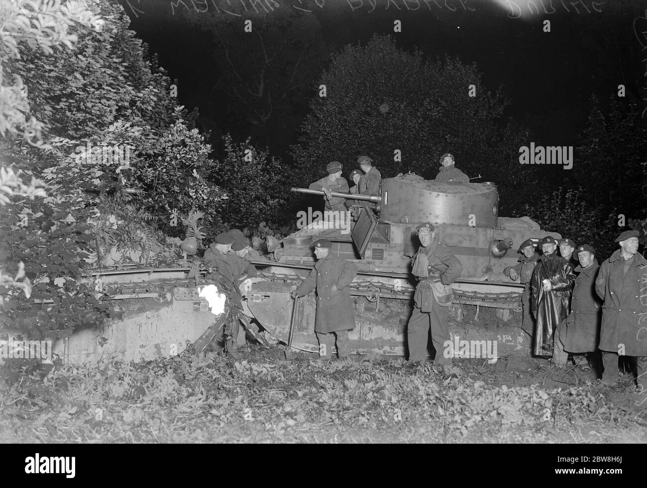 The night advance . Scenes  somewhere in Wilts  . Tanks under cover in the darkness . 27 August 1928 Stock Photo