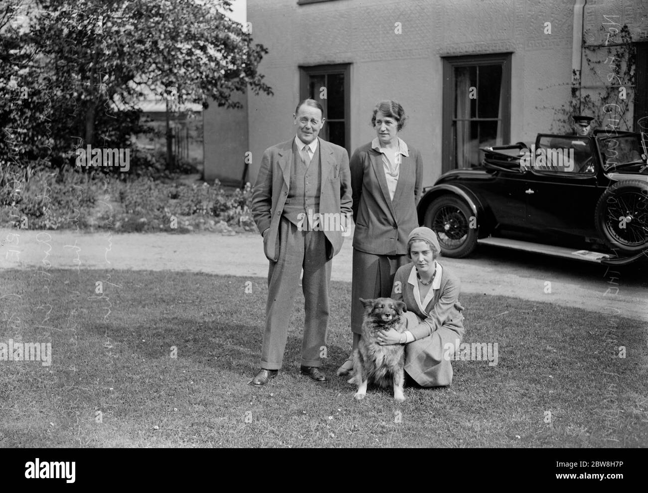 Miss Mollie Montgomorie , Mr Augustine Courtauld 's fiancee , photographed at her home in Braintree ( Essex ) on Friday after she had received the good news that Mr Courtauld was safe . Miss Mollie Montgomorie photographed at her Essex house with her mother and father and pet dog . 1931 Stock Photo