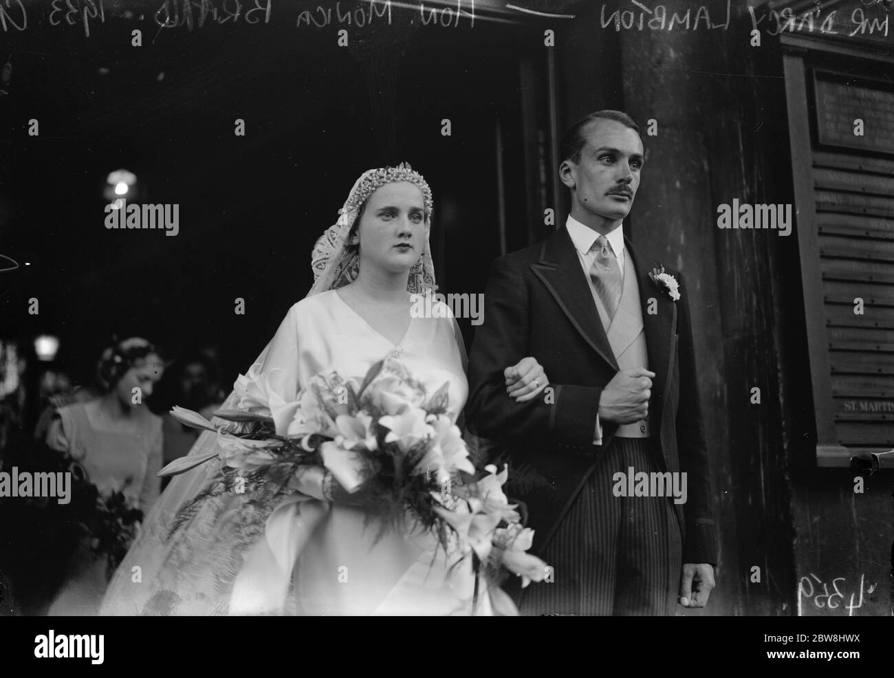 The Hon Monica Brand 's wedding . The Hon Monica Brand was married to Mr D'Arcy Lambton , at St Martins in the Fields . The bride and bridegroom . 9 October 1933 Stock Photo