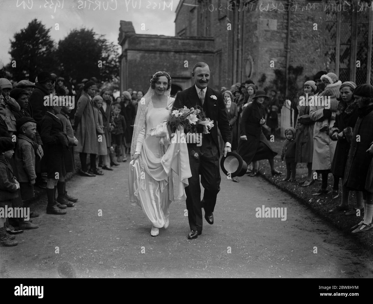 Duke 's nephew weds Viscount 's granddaughter . The marriage between John M Beckwith , DSC , and Miss Ivy Curtis , at Shrivington . The bride and bridegroom . 10 May 1933 Stock Photo