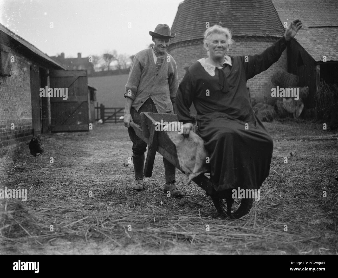 Thomas Couchman , Champion Ploughman In The Farmyard With His Wife 