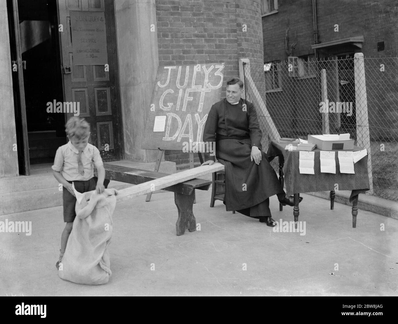 See saw , Vicar Rev Isaacson , Eltham . 1937 Stock Photo Alamy