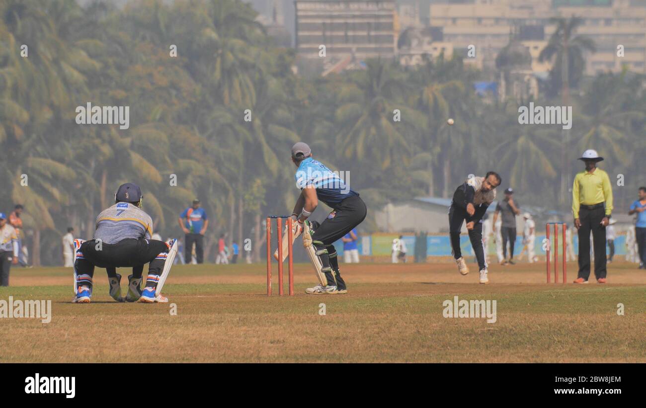 Mumbai, India - 5 december 2018: People playing cricket in the central park at Mumbai, Slow Motion view. Stock Photo