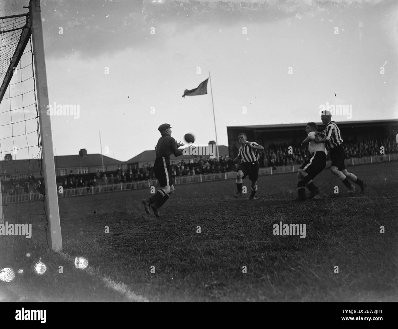 A goalkeeper catches an aerial ball . 1935 Stock Photo