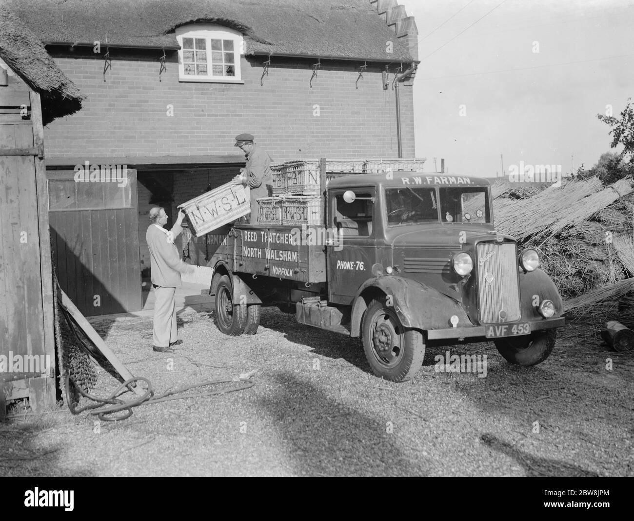 Bedford van , R W Farman . 19 August 1937 Reed Thatching in Norfolk. Mr R. W. Farman, of North Walsham, The last working representative of an old Norfolk reed thatching family. Stock Photo