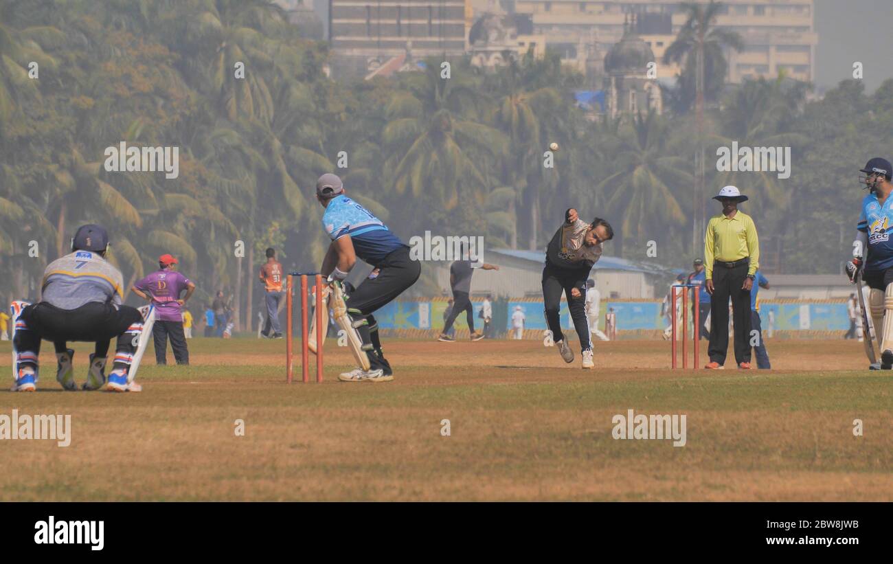 Mumbai, India - 5 december 2018: People playing cricket in the central park at Mumbai, Slow Motion view. Stock Photo