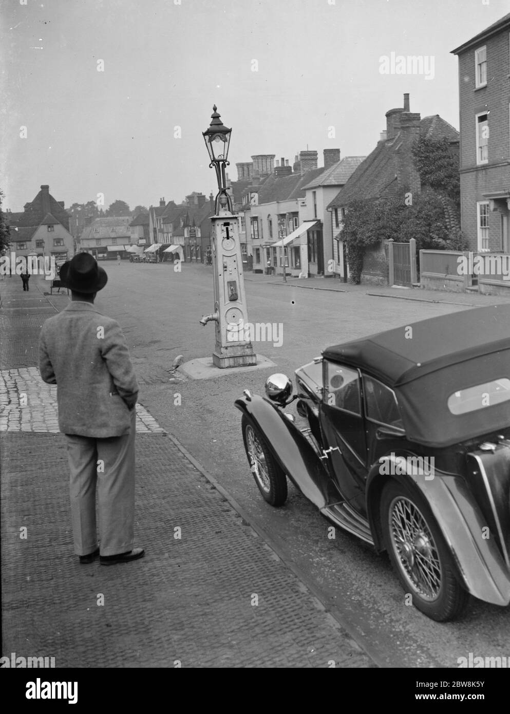 An old water pump used as a street lamp . West Malling . 14 September 1937 . Stock Photo