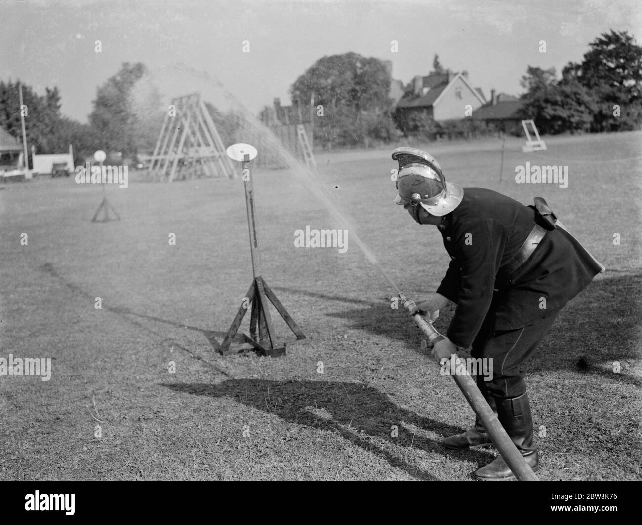 Erith and District fire brigade tournament . Fire hose drill . 1937 Stock Photo