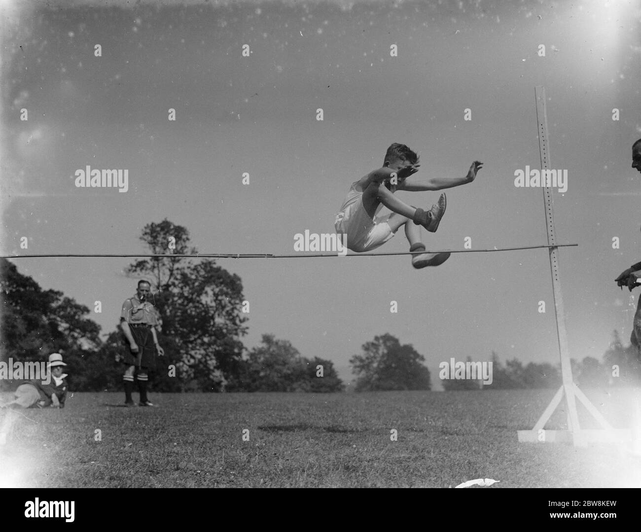 Sports day - a boy high jumping . 1935 . Stock Photo