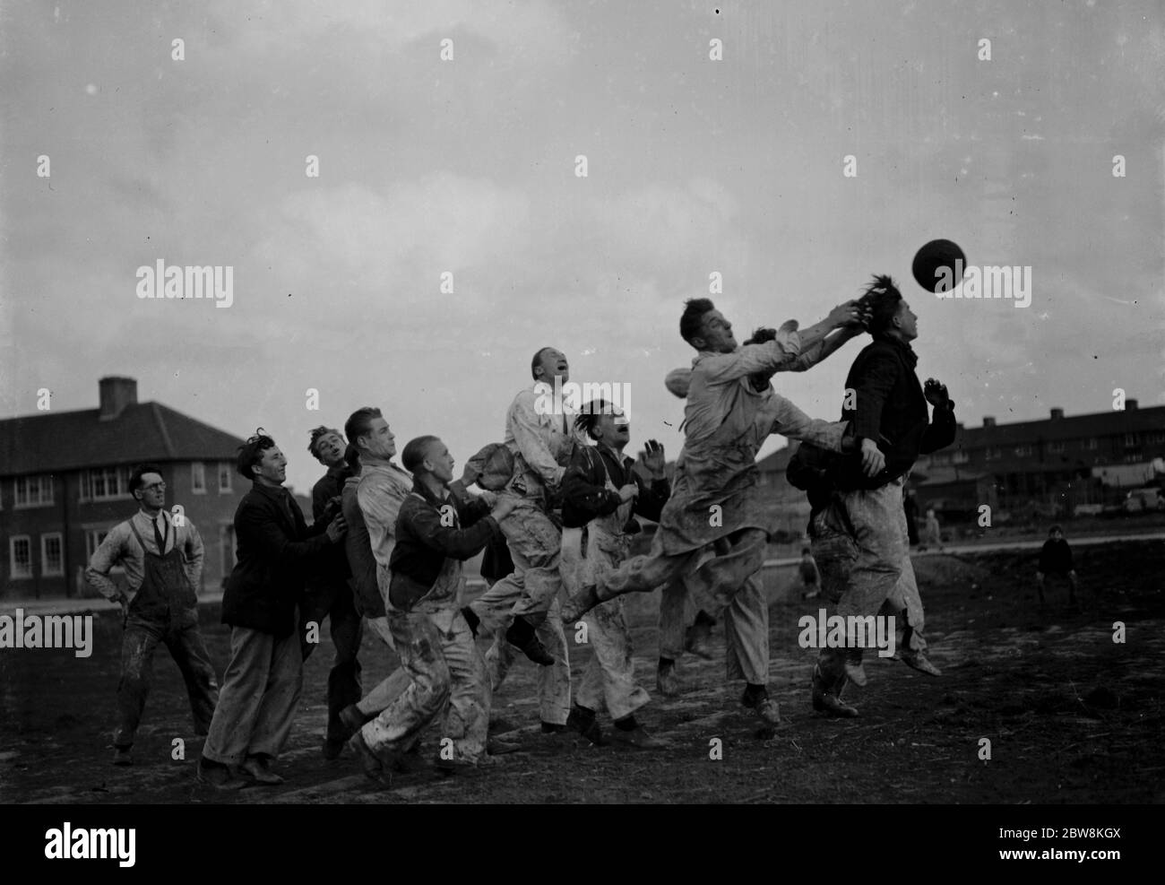 Workmans lunch hour in Mottingham , playing football . 1937. Stock Photo