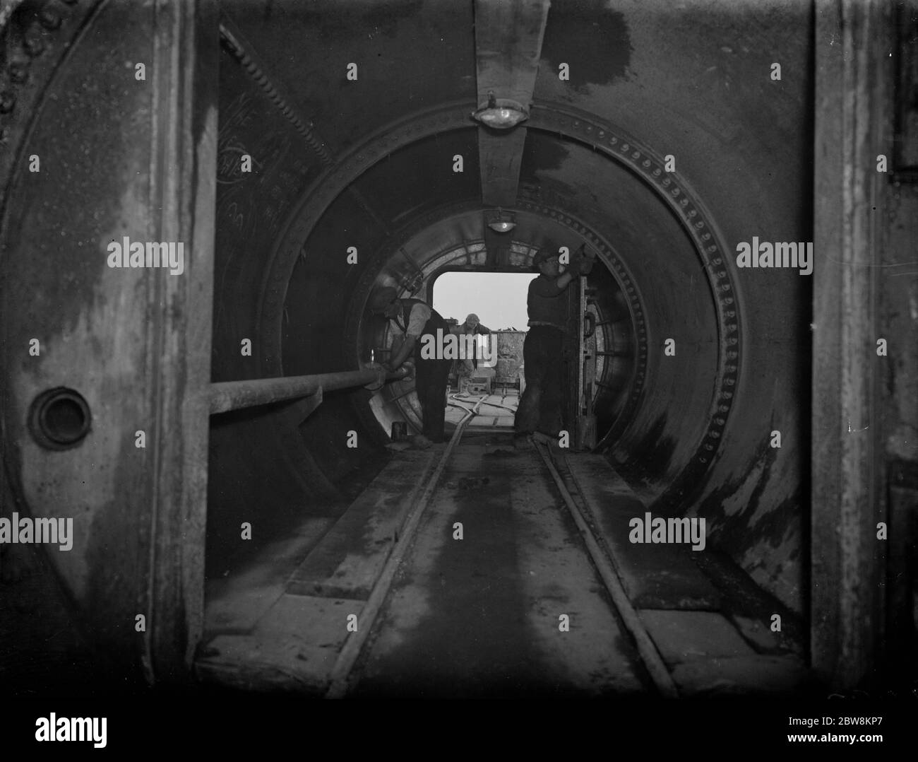 The Dartford tunnel men in one of the air locks . 1938 Stock Photo