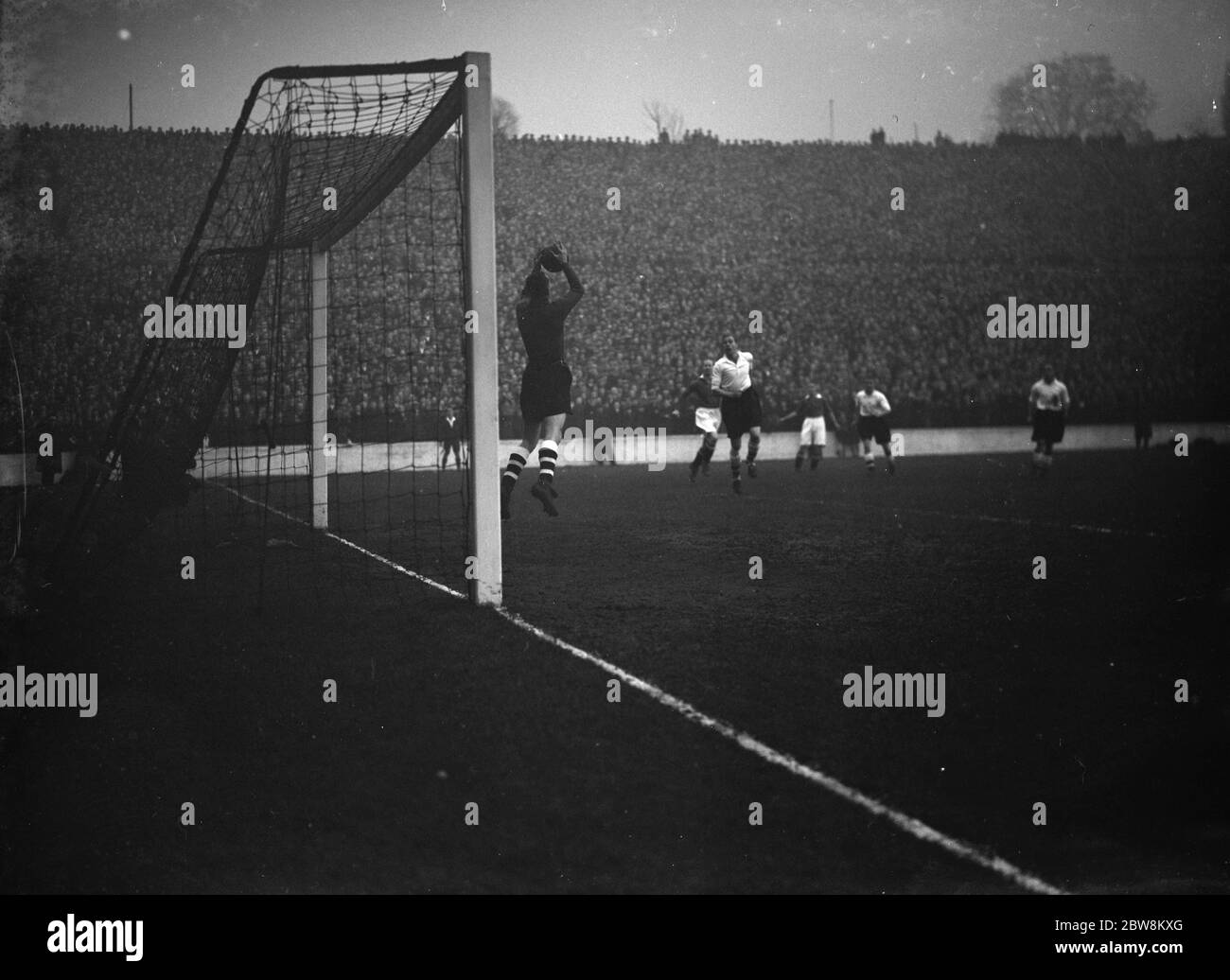 L P M versus Tooting in the FA Amateur Cup . One of the goal keepers takes an aerial . 27 November 1937 Stock Photo