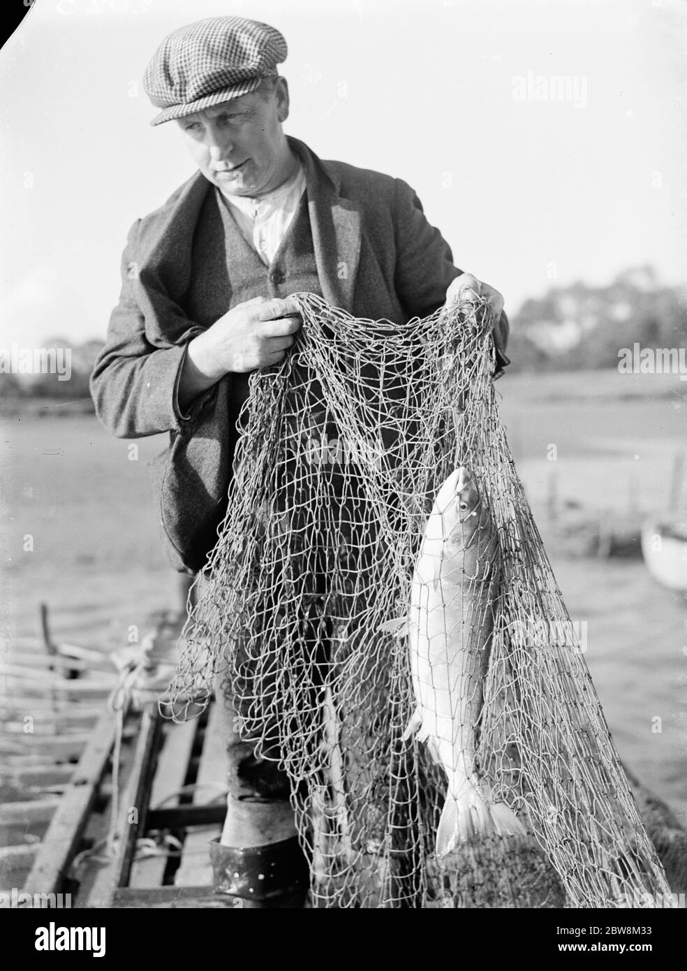Netting fishing Black and White Stock Photos & Images - Alamy
